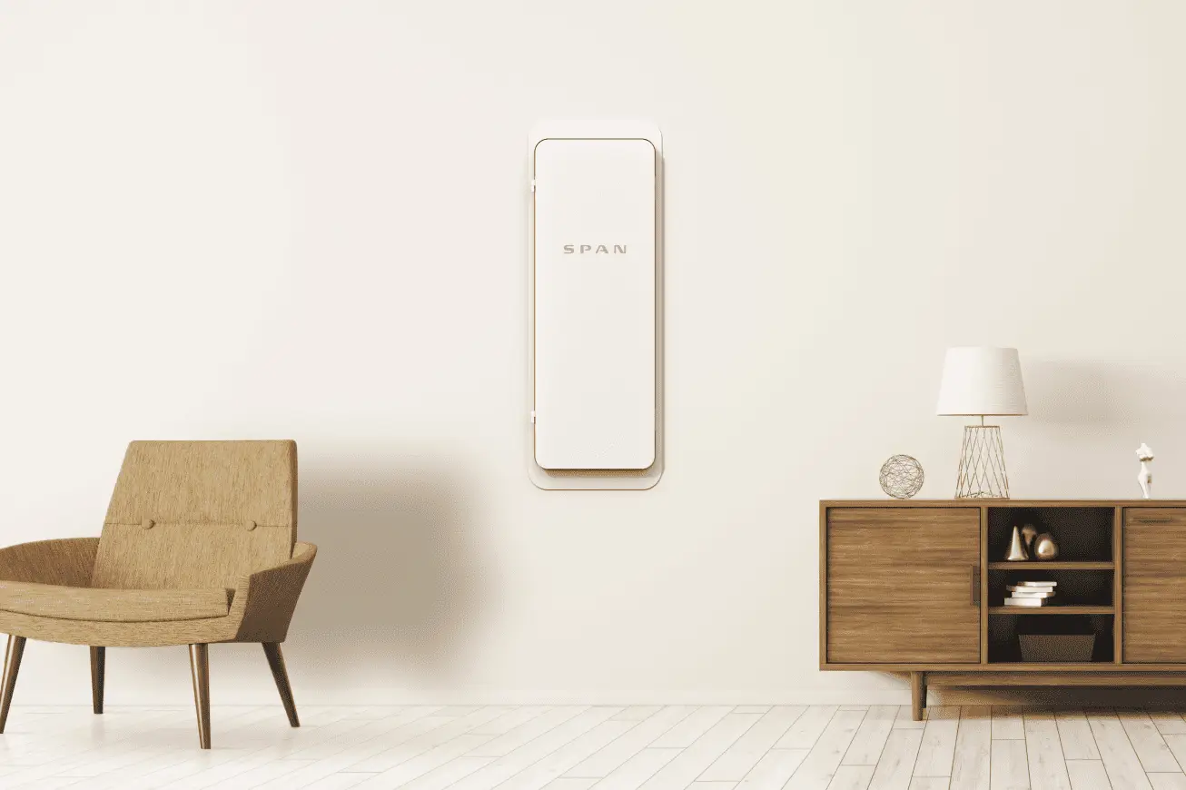 A modern smart electrical panel, like the Span Panel, mounted on the wall.