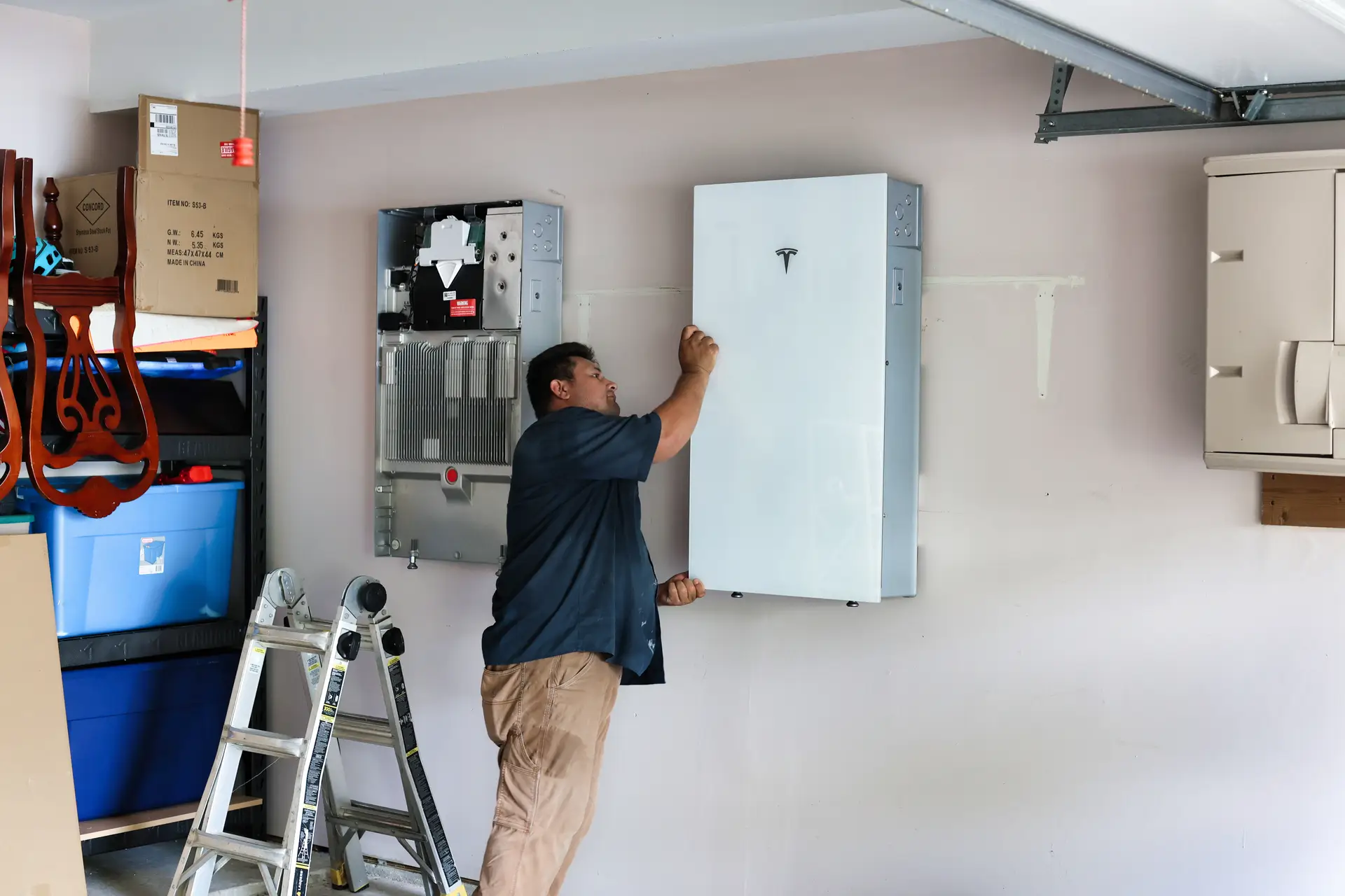 Solstice Solar installers installing Tesla Powerwall in Houston, Texas.